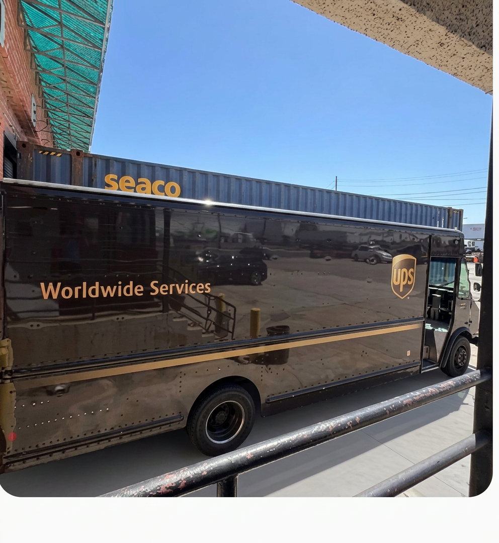 UPS Worldwide Services package car staged for daily parcel pickup beside ocean containers at Logix Fulfillment Vernon CA warehouse