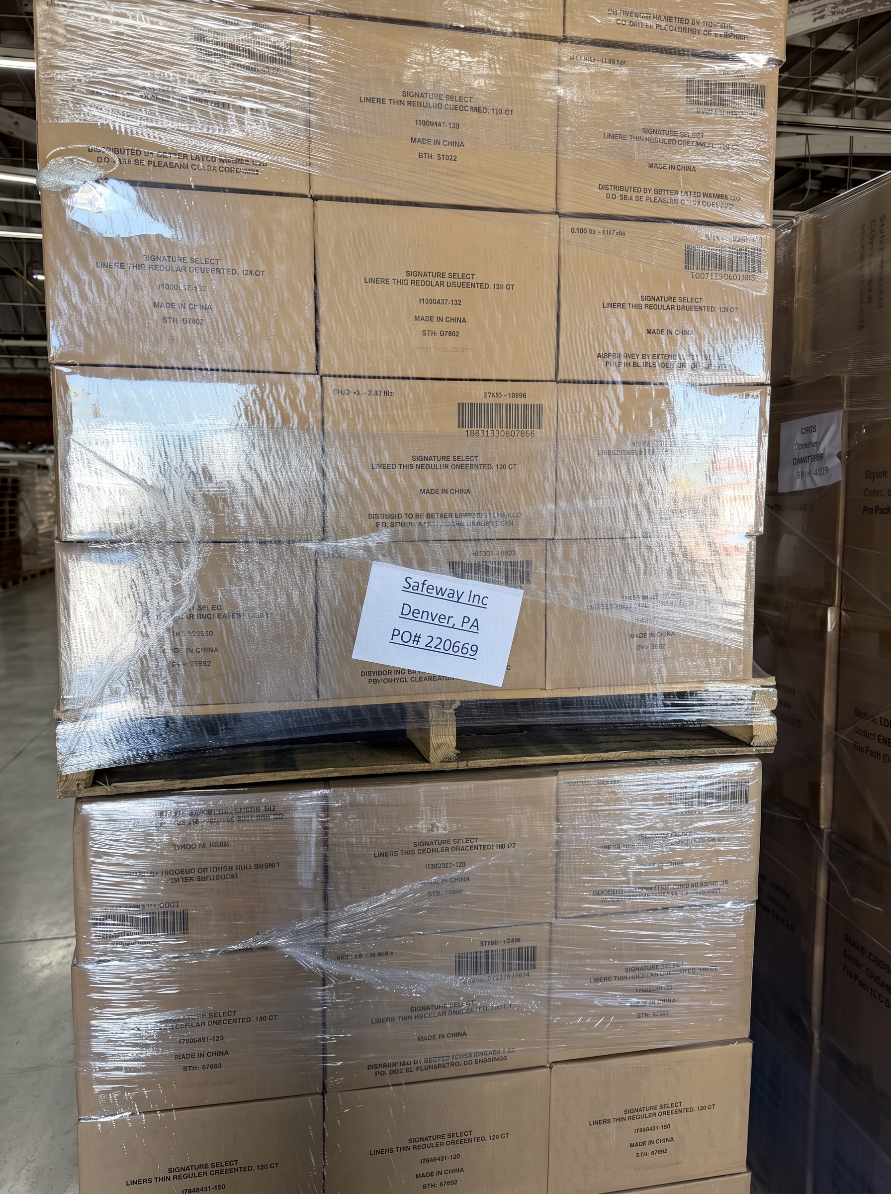 Palletized grocery cartons tagged with a retailer purchase order for a distribution center delivery at Logix Fulfillment Vernon CA